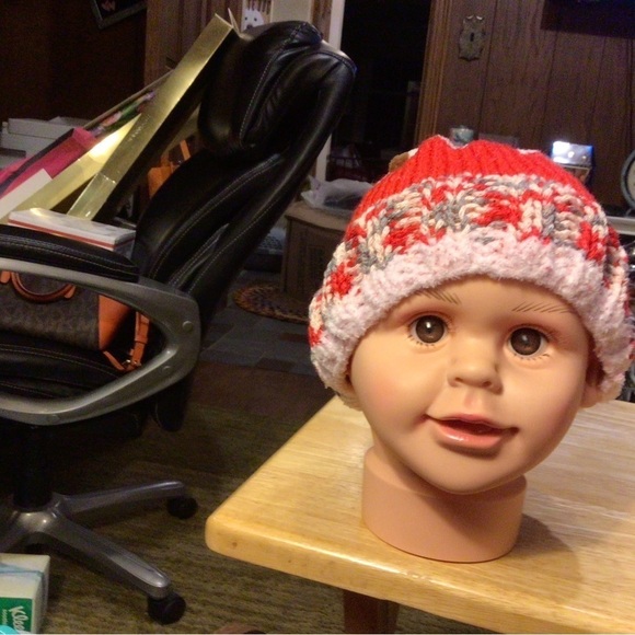 Hand knitted baby hat. The pom-pom is at football.​​ - Picture 1 of 2